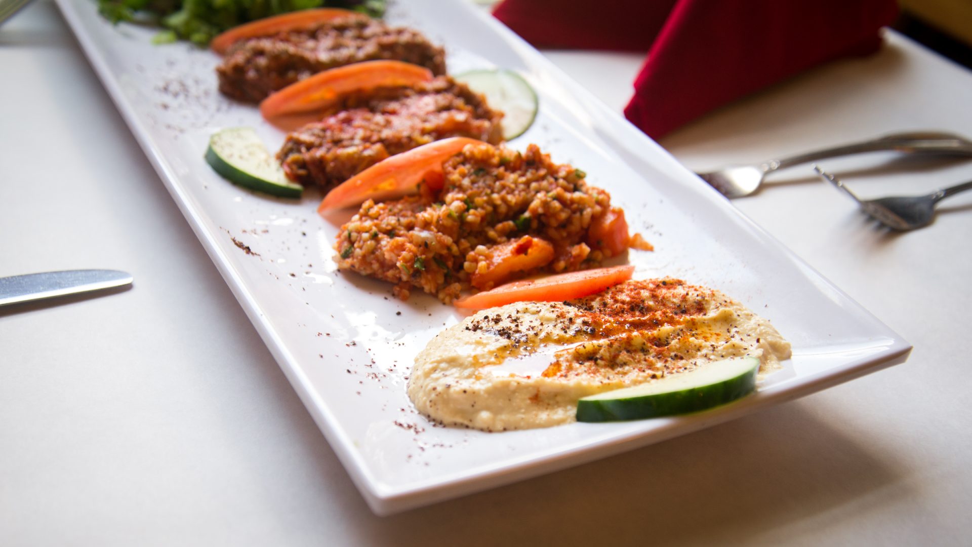 Appetizer Combo featuring Hummus, Tabouli, Babaganush, Salsa, Dolma and Ezme